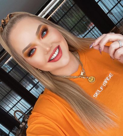 Image 1: NikkieTutorials’ Instagram feed, with pinned comment by Nikkie reading ‘she’s a happy girl 😇✨’. Source: nikkietutorials on Instagram, posted February 24, 2020 