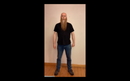 A person with long hair Description automatically generated with low confidence
