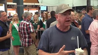 Tim Walz drinking a milkshake with a straw