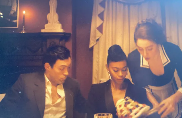 Rupert reaches under Taggie’s dress at the Jones’s dinner party in Rivals